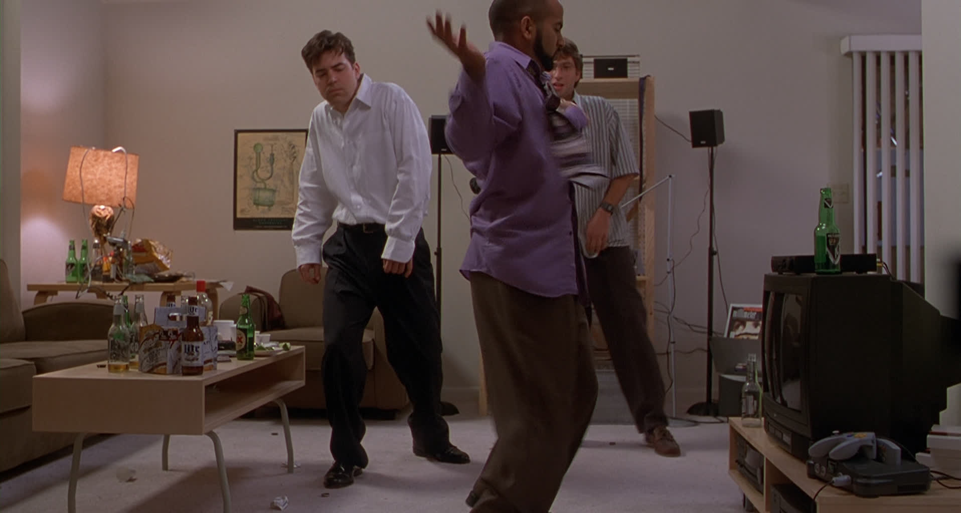 Image of the three programmers from Office Space dancing, with a Nintendo 64 on the right side of the frame
